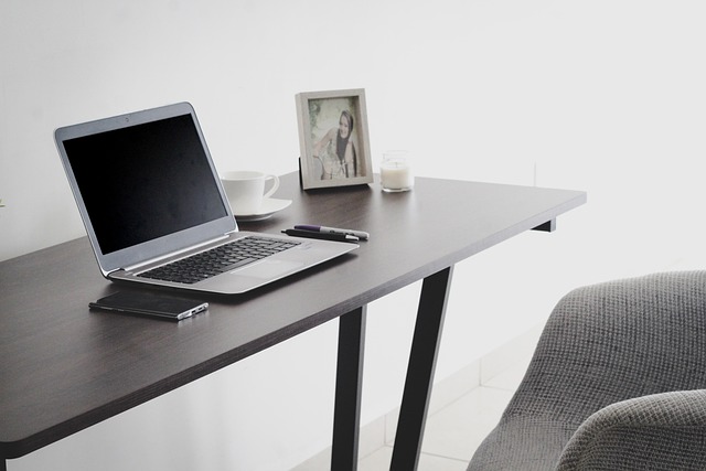 remote technical support specialist with headset at computer workstation
